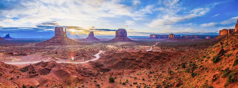 A panoramic view of Monument Valley showing East and West Mittens and Merrick Butte